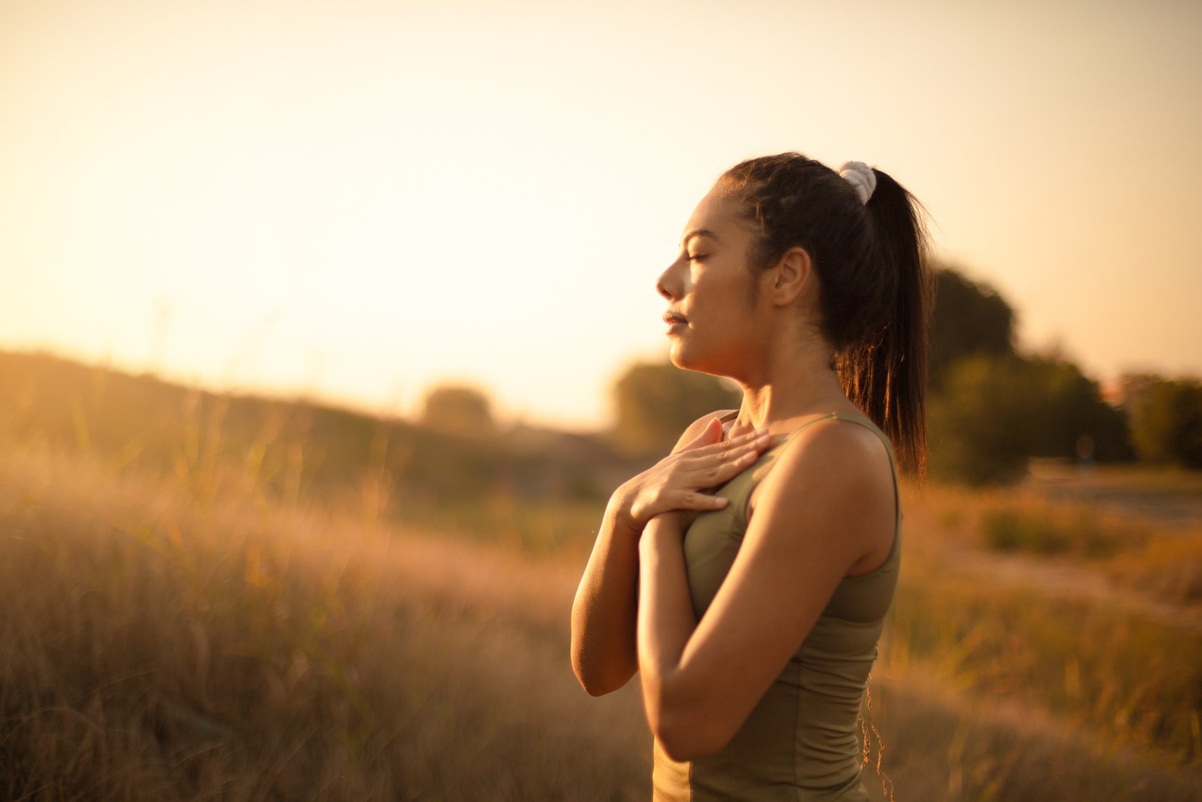 Young woman practicing breathing yoga.